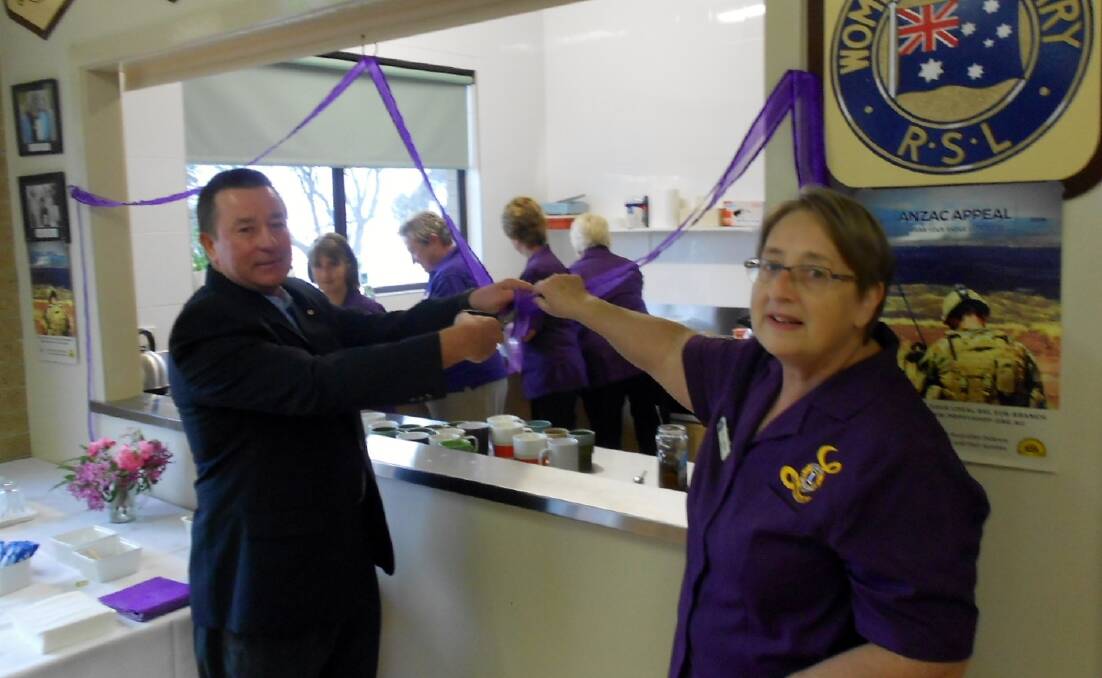 Fundraiser: Peter Law from the Mumbulla Foundation cuts the ribbon at the opening of the new RSL kitchen at the Eden Lioness Biggest Morning Tea. Story page 10