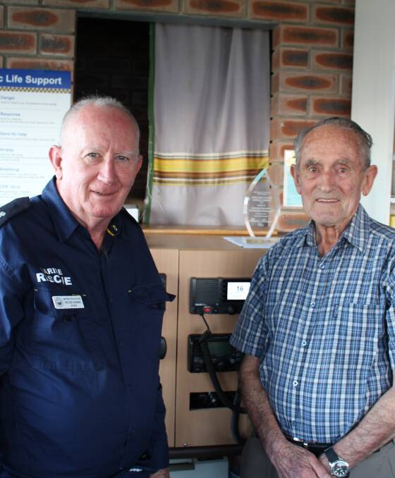 Eden Marine Rescue volunteer Peter Horne shows former volunteer for 21 years Murray Jarvis how much has changed in the radio room. 
