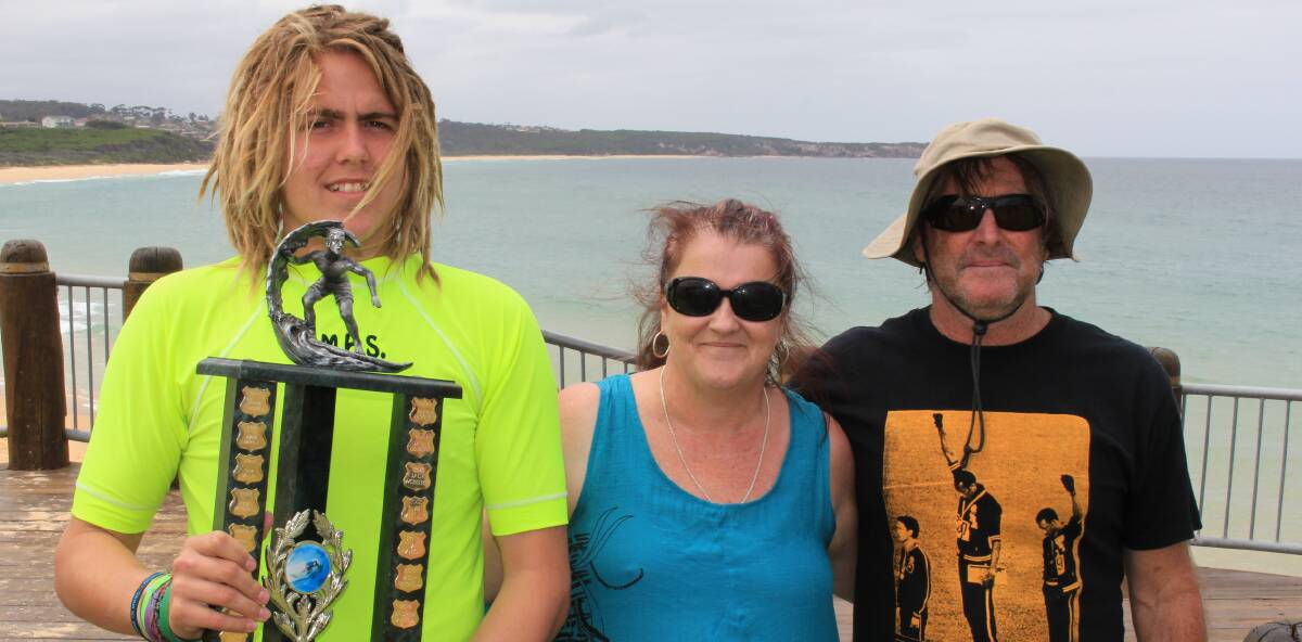 Respect the surf: Josh Boundy is presented with the Jason Bush Memorial Trophy by Rachael Bush and Bernie Langford at Short Point on Thursday, December 15.