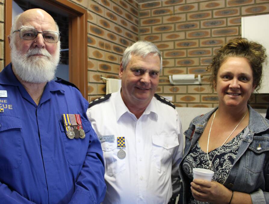Marine Rescue volunteers John Steele and Bill Blakeman with Tracy Bennett from the Australian Boarder Force at the 30th anniversary celebration.