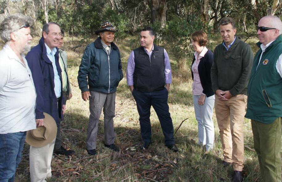 Traditional food: Pastor Ossie Cruse with MPs Andrew Constance, Leslie Williams and John Barilaro during a Bundian Way tour on Friday, May 13 