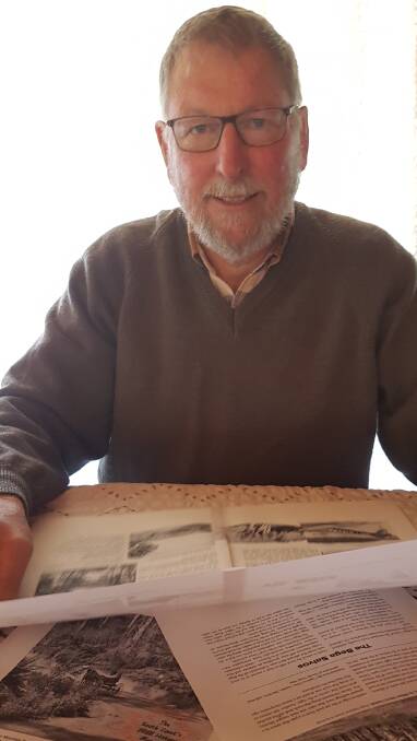South Coast History Society President Peter Lacey checks proofs of the October issue of ‘Recollections’.