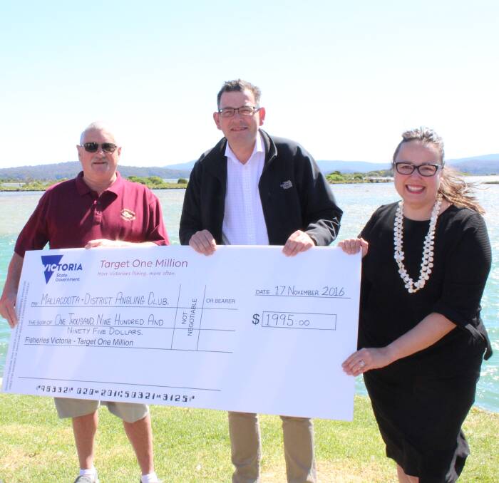 Sustainable future: Mallacoota and District Angling Club vice president Ian Green receives a grant of $2000 from Victorian Premier Daniel Andrews and Member for Eastern Victoria Harriet Shing. Picture: Melanie Leach
