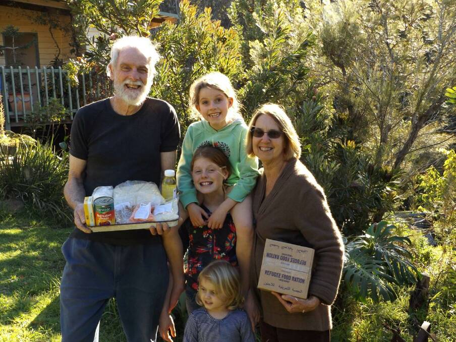 Tough week: Peter and Pam Skelton with their Refugee Ration challenge packs for the week with Arlie, Uluka and Ottilie Richardson.