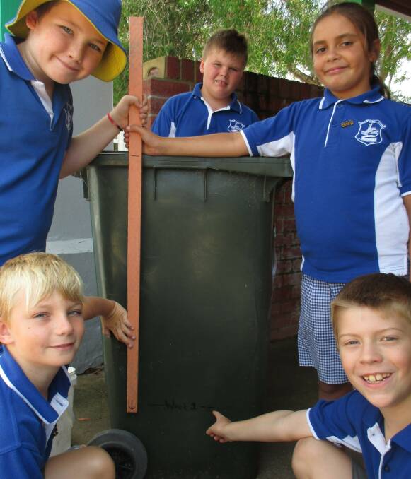 Waste Warriors: Eden Public School students Joey Wilson, Aden Farmer, Shanoa Bamblett, Jack Young and Noah McConnell audit how much green waste the school produced before the worm farms. 