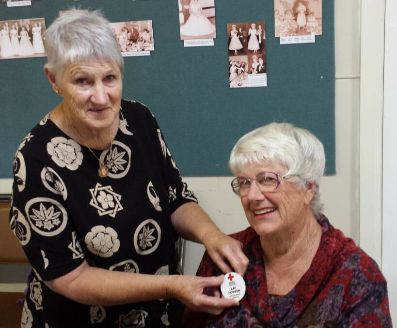 Volunteers: Wolumla Red Cross president Carol Newton gives a warm welcome to new member Kay Dowton at the club's recent meeting. 