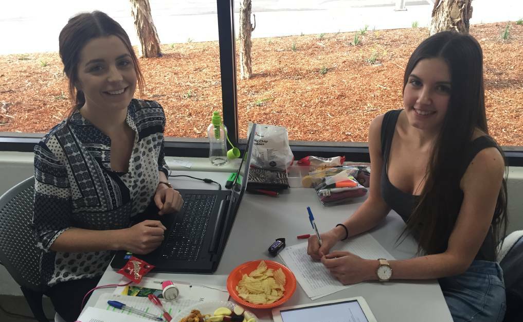 Bega High students Kaytlen Walsh and Alysha Troy prepare for their HSC exams at the Bega Library Lockdown in 2016.