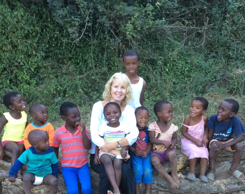 Making a difference: Libby Weir and the South African children when she volunteers for months each year in Kwa Zulu, Natal.