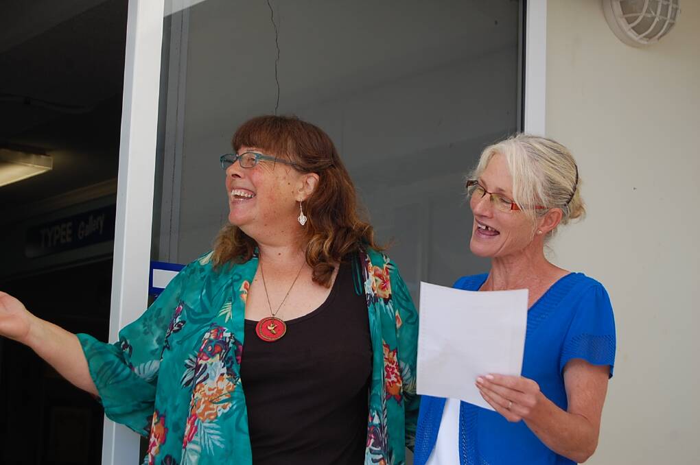 Author Susie Sarah (left) and yachtswoman Tracey Chubb join in the singing of "I Am Woman".