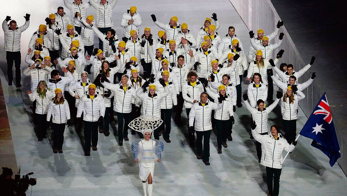 • Alex Pullin (front, right) leads the team of Australian Olympians during the opening ceremony last week. 
