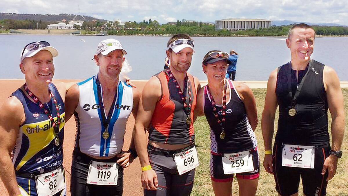 • Local athletes gearing up for a Canberra triathlon are (from left) David Dwyer, Grant Regan, James and  Lisa Lukassen and Simon Byrne.