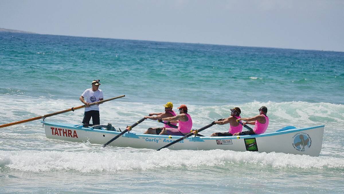 • The Tathra surfboat crew surges to the beach at Narooma during Tuesday’s leg of the George Bass Surfboat Marathon. 