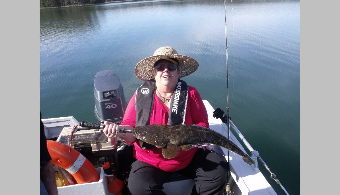 DAL FLATHEAD: Colleen Pearce from Yarram, Victoria got this beaut 70cm dusky flathead on a Z-man soft plastic fishing in Mummaga Lake, Dalmeny last Wednesday with local Narooma guide Bill from Calm Water Charters. The fish was released.