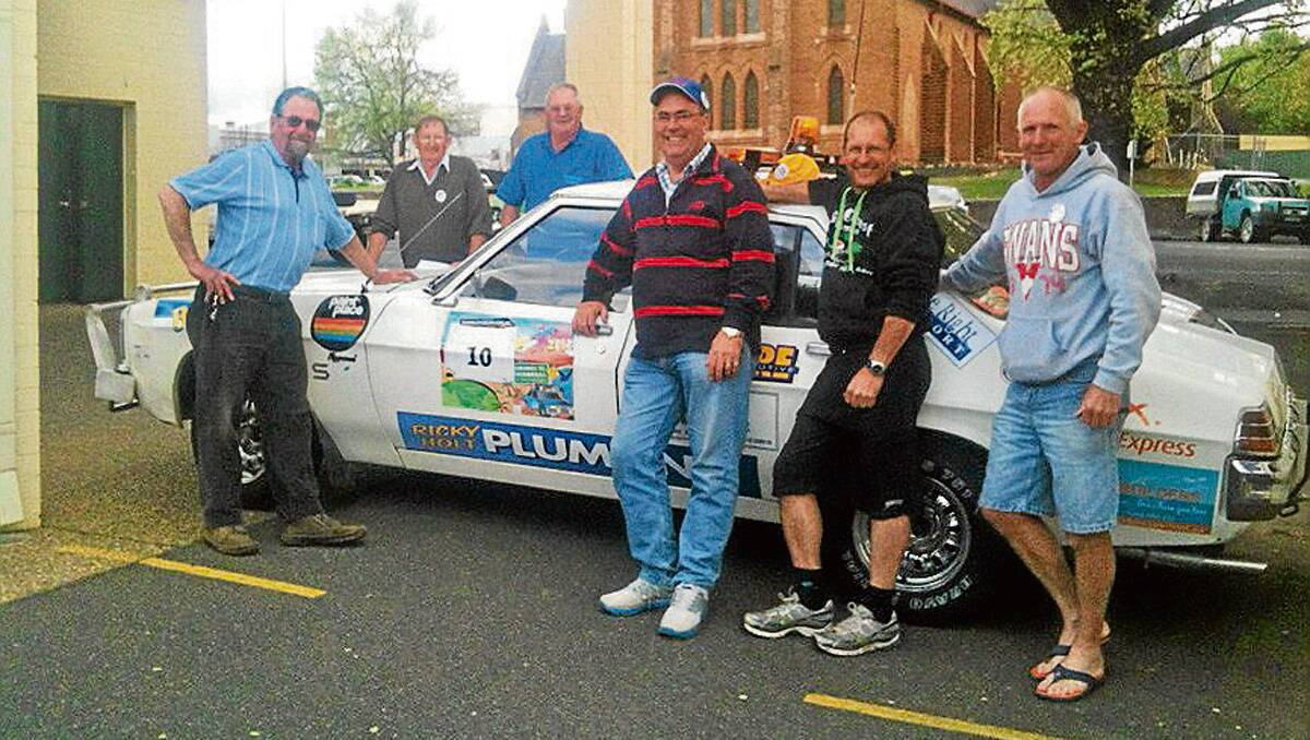 •  Team Hammond support crew member Lou Roper, left, Tathra’s ‘Great Escape’ participants John Daly and Bob Barker, Hammond support crew member Hugo White, and drivers Bryan Hammond and Ricky Holt, were ready to rally at Orange on Monday night.