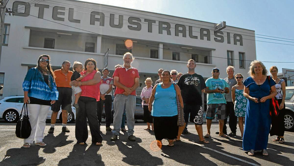 HERITAGE PUSH: Eden residents responded to a call for a photo outside the iconic Hotel Australasia on Tuesday morning, including Peter Whiter (third from left at the front) who is now leading the charge to heritage list the building. 