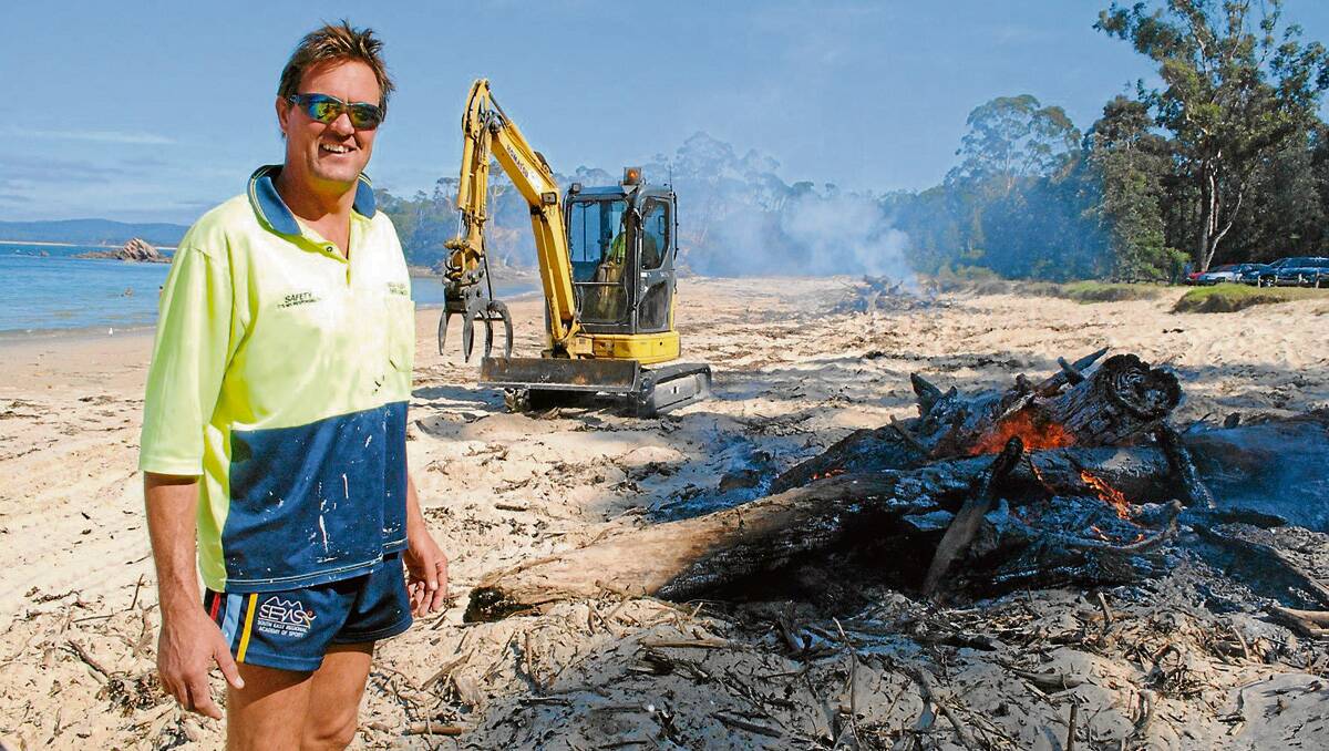 • Flood cleanup: Marty gets busy at Cocora Beach following major floods in March 2011.