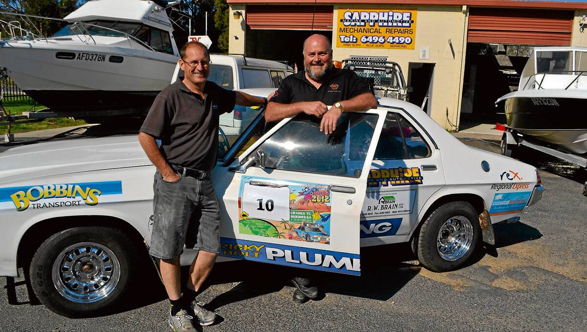 • Almost ready: The Great Escape entrant Bryan Hammond of ARV Eden with mechanic Wayne Holding who has donated more than 40 hours labour to get the 1978 HZ Holden ready to rally.