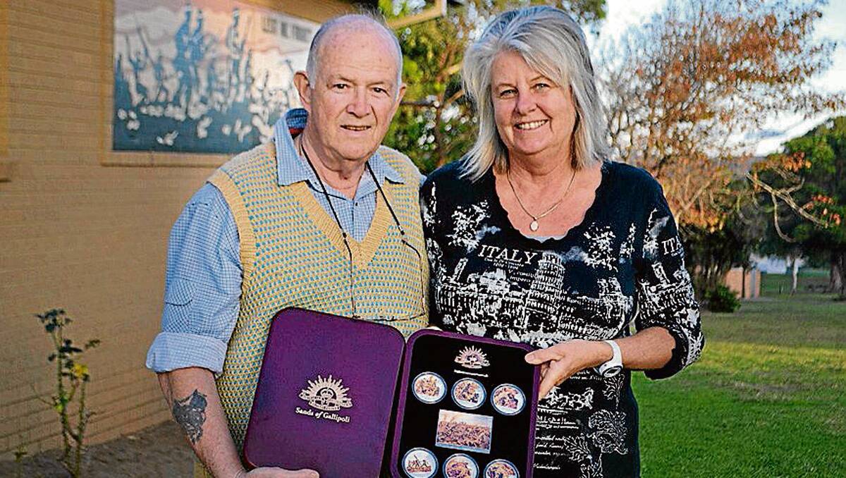 Eden writer Amanda Midlam donates a boxed set of Anzac medallions prize to Eden RSL sub-branch president Barrie Beck after penning a piece that won the Magnet’s Sands of Gallipoli Anzac Day competition.
