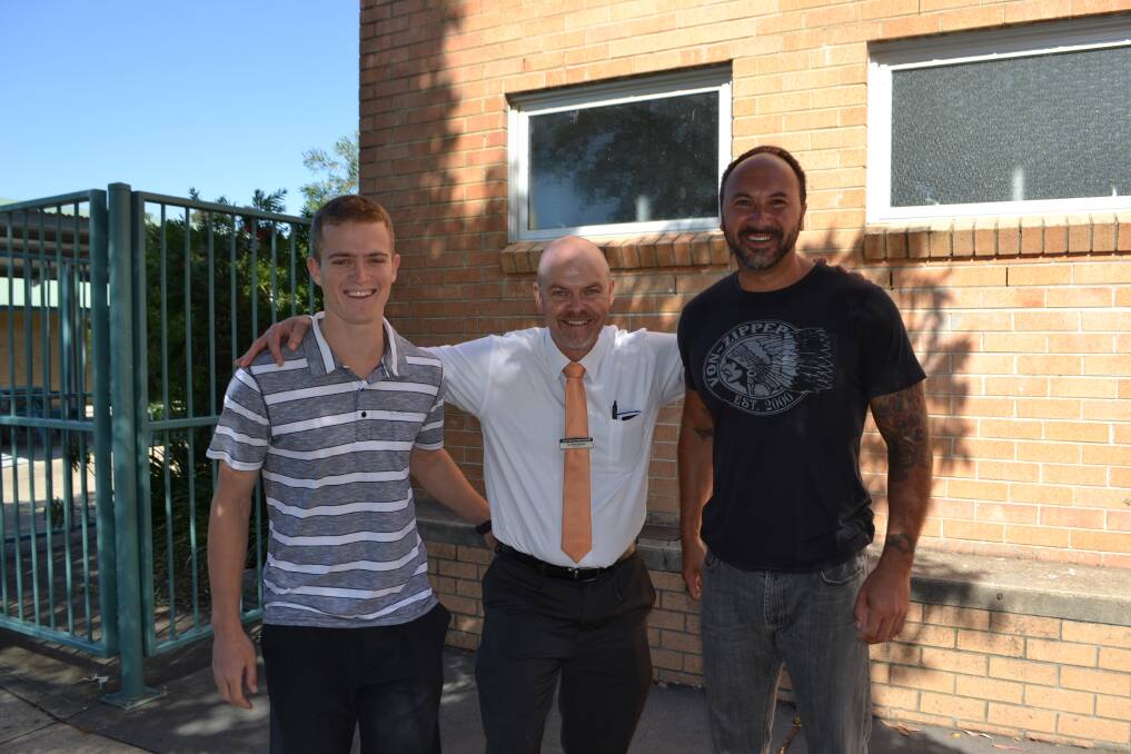 Principal of Eden Marine High School Ian Moorehead, centre, with two of his new permanent staff members; Tom Keath, left, and David Barros. Michelle Bond and Angie Butler, the other two new permanent staff members were busy with their classes and unable to be found for a photo.