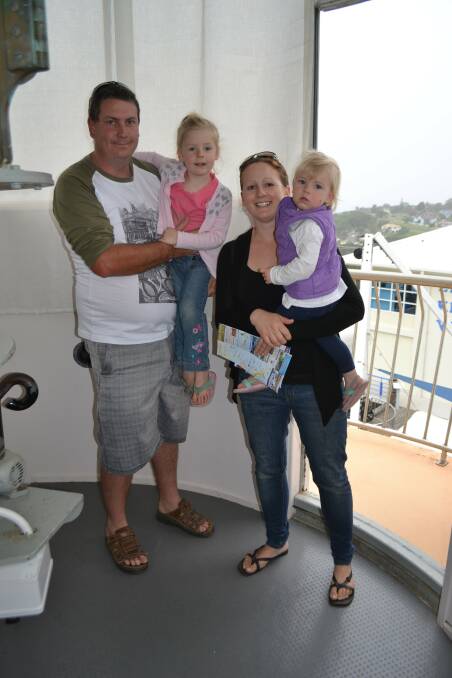 Grant Scott holds Emily, and Trisha with daughter Jessica enjoyed their second visit to the Eden Killer Whale Museum this morning. The family from Wodonga are enjoying a break from 40 degree temperatures back home. "We love Eden, its heaps better than Merimbula, not as busy!" Grant said. 