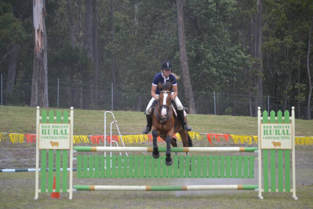 Melinda Armstrong on Sugar and Spice jumps clear in the 1 metre event, taking out 5th place in the event.