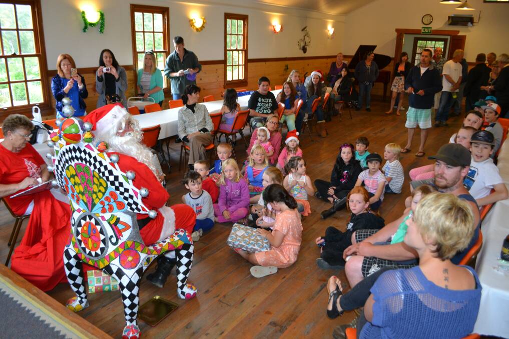 Santa thrilled children at Saturday's Nethercote Christmas Party with lollies and presents. 