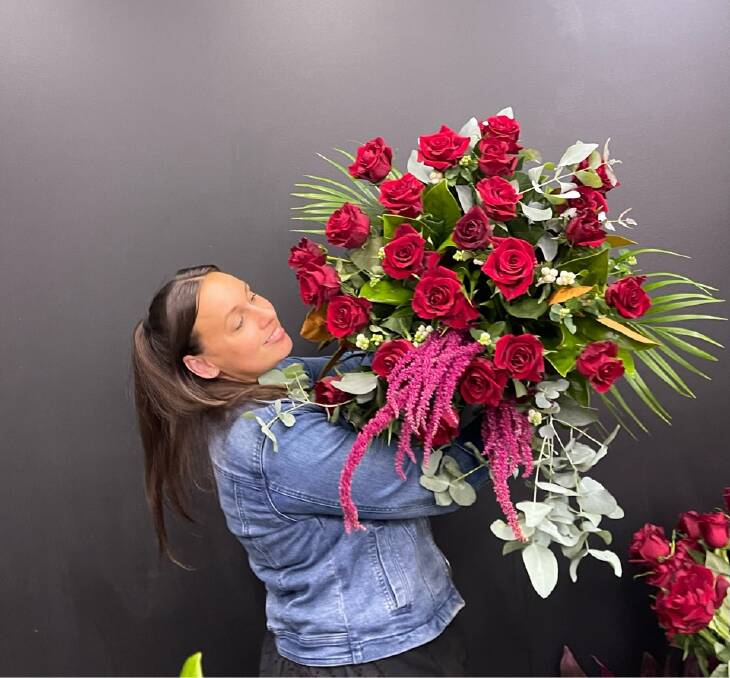 Jasmine Fleet owner and florist of The Little Bouquet with one of her lavish Valentine's Day bouquet. Picture supplied. 