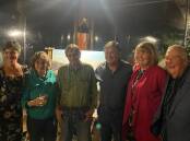 Smiles all round at the live art fundraiser hosted at Wheelers. Left to right: MC Michelle Pettigrove, artists Ann and Glenn Morton, MC Frankie J Holden and highest bidders Carolyn and Michael Saukeld. 