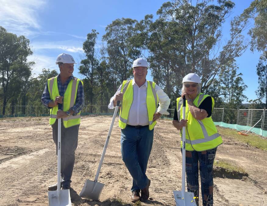 Community members celebrate the start of the Kiah Community Hall rebuild. Left to right - Andrew Constance, Russell Fitzpatrick and Clare McMahon, picture taken by Amandine Ahrens. 