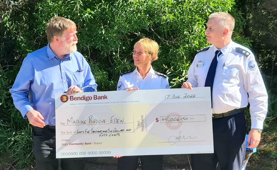 Bendigo Bank representative Graham Stubbs presents a cheque of $45k to UC Nancy Weatherman and Zone Commander South Mike Hammond. Photo: Fay Cousin