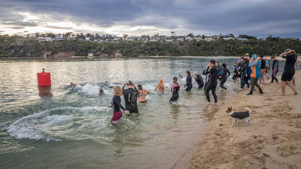 People jumping in for the 120 metre splash n dash event at Mitchies Jetty for the 2021 WinterSun Festival. Photo: David Rogers 