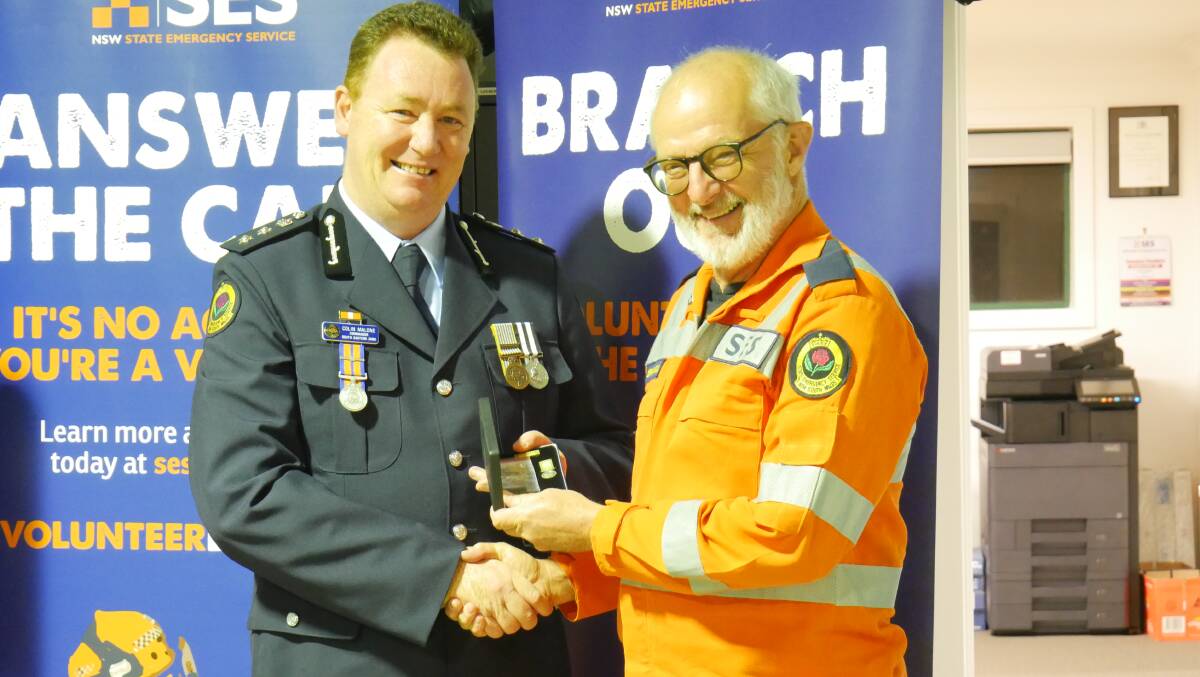 South Eastern zone commander Colin Malone and award recipient Brian Evans. Photo: Ellouise Bailey 