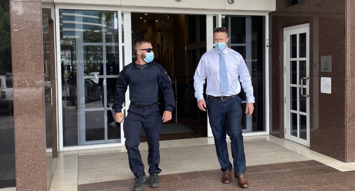 POLICE WITNESS: Witness Acting Senior Sergeant Evan Kelly, right, leaves the Darwin Supreme Court.