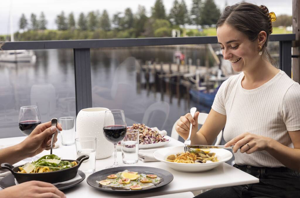 Enjoying the food and the harbour-side setting of Il Passaggio at Bermagui Fishermen's Wharf. Picture supplied