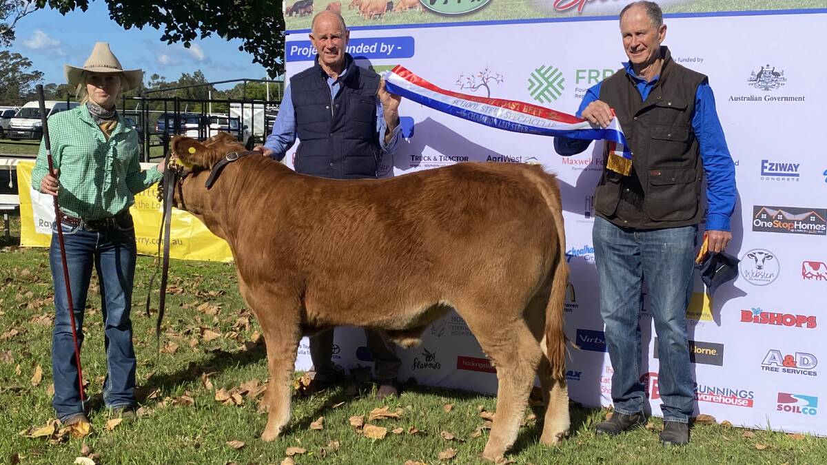 Narooma High School Year 11 student Kirra McCaughtrie with the winning steer. With her are the breeders John and David Cullen who have donated the steer to the school. Picture supplied.
