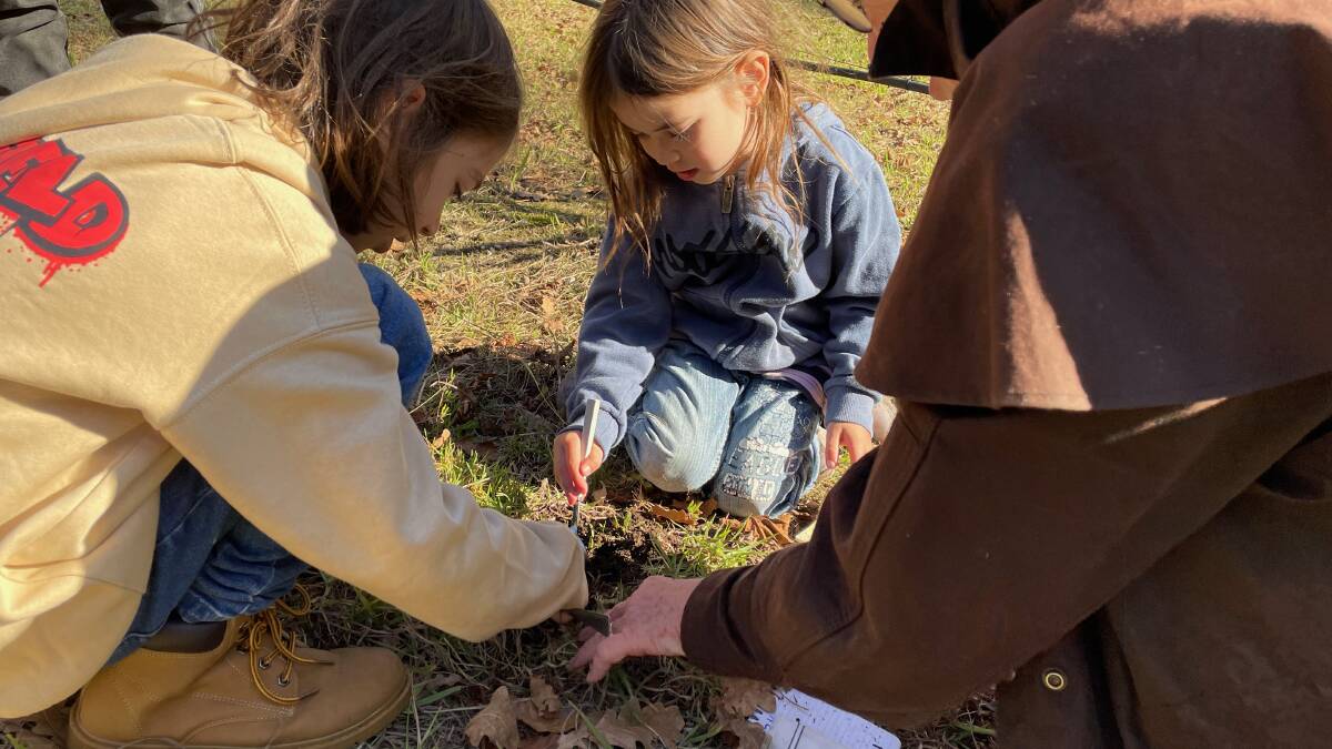 Ethan and Fallon loved sniffing out the truffles and gently getting them out of the ground using a spoon at the Gulaga Gold truffle hunt on Saturday, June 17. It was the first of seven truffle hunts that are part of the Fungi Feastival which runs from June 16 to July 16 from Batemans Bay to Eden. Picture by Marion Williams.