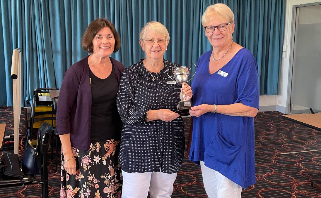 CWA Far South Coast group handicraft officer Sharron Perry with visiting judge Ruth Shanks and Marion Cullen from Narooma branch with the trophy for champion exhibit in the CWA group level handicraft competition. Picture by Marion Williams