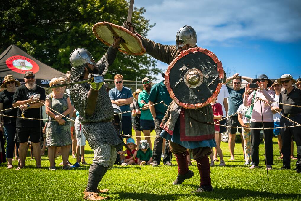 Halfdan and Snorri, Viking reenactors from the Sea Wolves, during one of the Medieval festival's combat shows which drew large crowds to Pambula. Picture by Zach Hooker