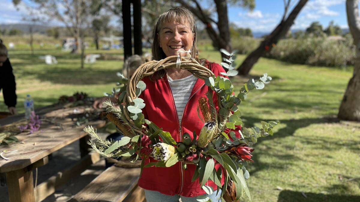 Terry Prowse with her beautiful creation after a floral wreath workshop with Wyndham Flower Farm and BourndaGrow. Pictures by James Parker