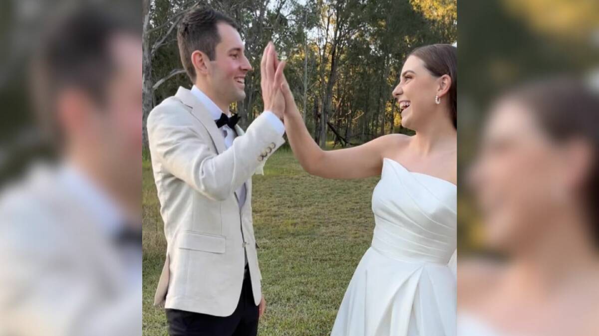 Newlyweds Mitchell Gaffney and Madeleine Edsell are photographed hours before a bus transporting wedding guests to Singleton crashes near Greta. 
