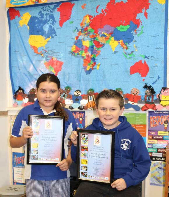 WE ARE ONE: Harmony Day Poster Competition NSW regional winner Jaylah Mundy and  runner-up Jake Priestly have returned from Parliament House in Sydney where they were presented with their awards. Picture: Liz Tickner