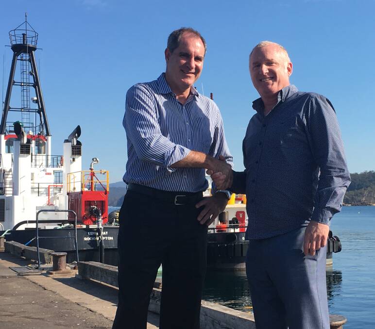 DONE DEAL: Port Authority of NSW chief operating officer Kell Dillon with Sapphire Coast Tourism executive officer Anthony Osborne.