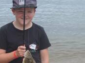 Beau catches a flounder at last year's Kids Gone Fishing Day in Eden