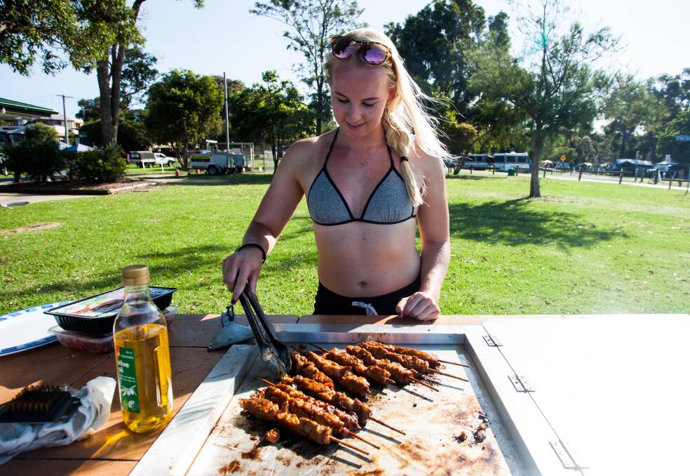 Juliette Meuser from the Netherlands visits the region over Christmas, cooking on the barbie after a day of swimming. Picture: Rachel Mounsey