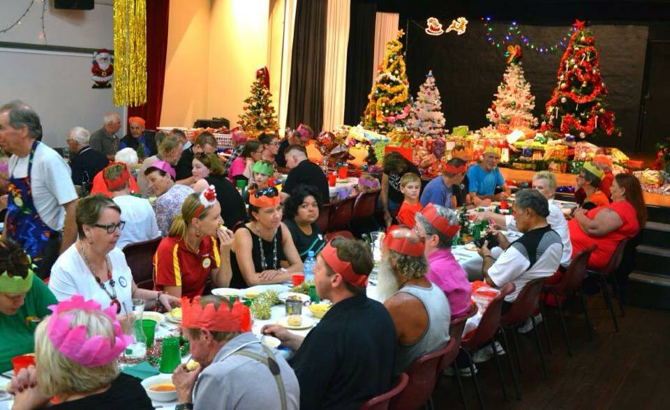 OPEN INVITATION: Diners enjoy a community Christmas lunch at Merimbula last year. It proved so popular there are three venues this week.