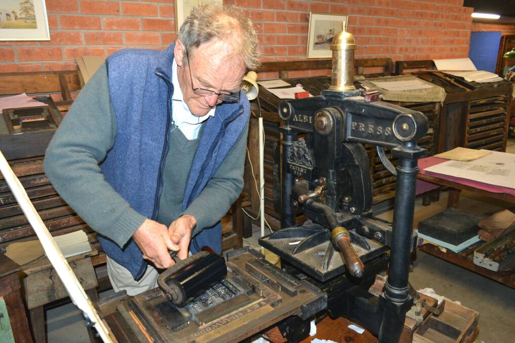 LOST ART: Richard Jermyn demonstrates the art of printing using lead lettering, ink and a historic Albion Press from his fascinating private collection. Photo: Ben Smyth