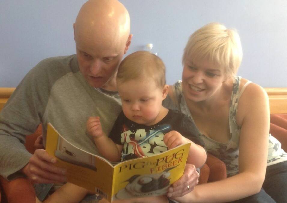 Ben reads a story to his son Luca during his most recent stay in St Vincent's Hospital Sydney