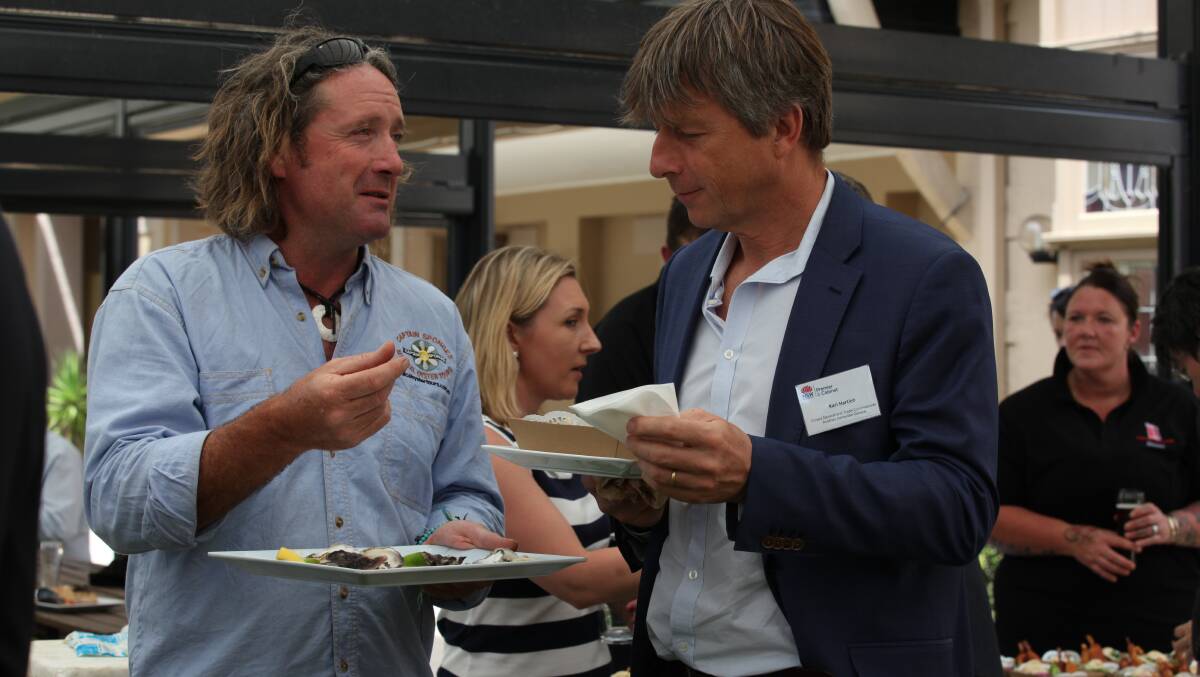 Brett Weingarth from Captain Sponge's Magical Oyster Tours talks oysters with Austrian Consul General Karl Hartleb at the Taste of Eden Festival sampler in 2018. Picture: Rachel Mounsey