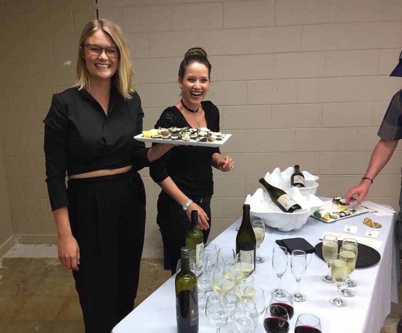 Nicky and Stef from Wheelers Restaurant serve oysters and bubbles at the opening