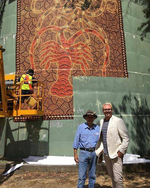 Eden Aboriginal Elder Uncle Ossie Cruise with Bega Valley Regional Gallery director Iain Dawson at the installation on the water tower. 